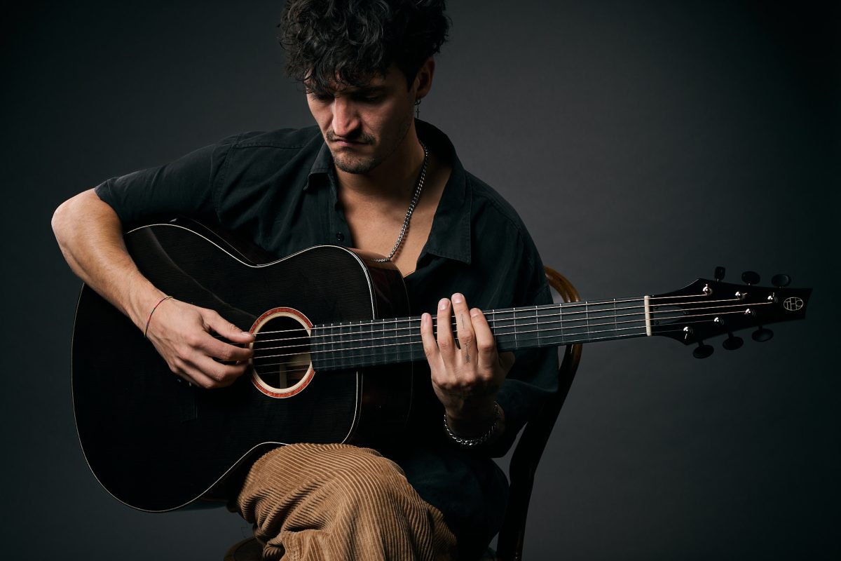 A Person is playing Thom Orgler Guitars Latemar Model